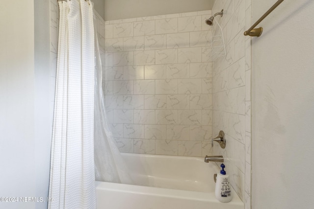 bathroom featuring shower / bathtub combination with curtain