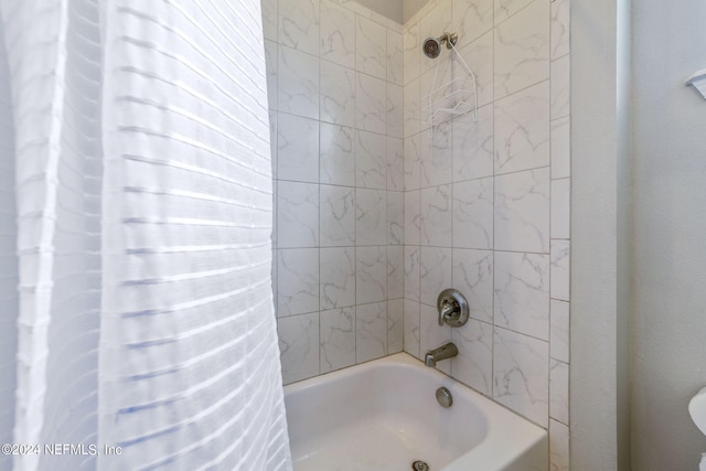 bathroom with shower / tub combo