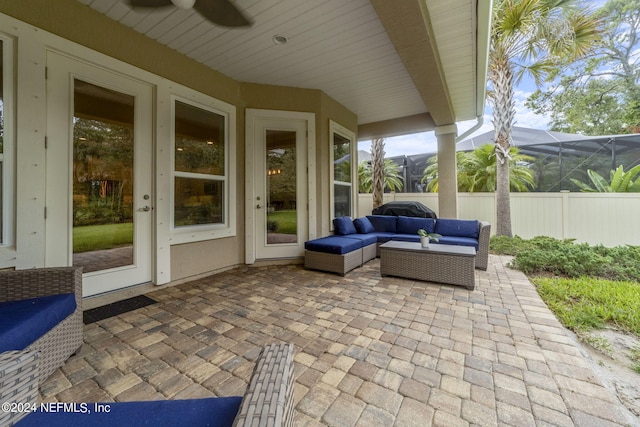 view of patio featuring ceiling fan, a lanai, and an outdoor hangout area