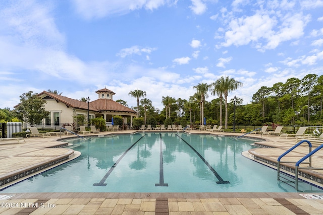 view of swimming pool with a patio area