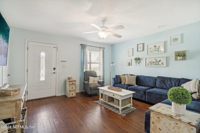 living room featuring dark hardwood / wood-style floors and ceiling fan