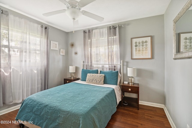 bedroom featuring ceiling fan and dark wood-type flooring