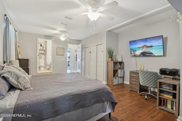 bedroom featuring dark hardwood / wood-style floors, ensuite bath, and ceiling fan