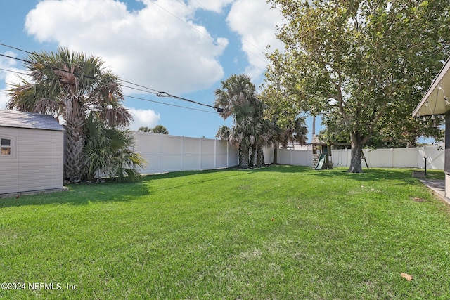 view of yard with a storage shed