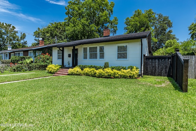 ranch-style house with a front yard