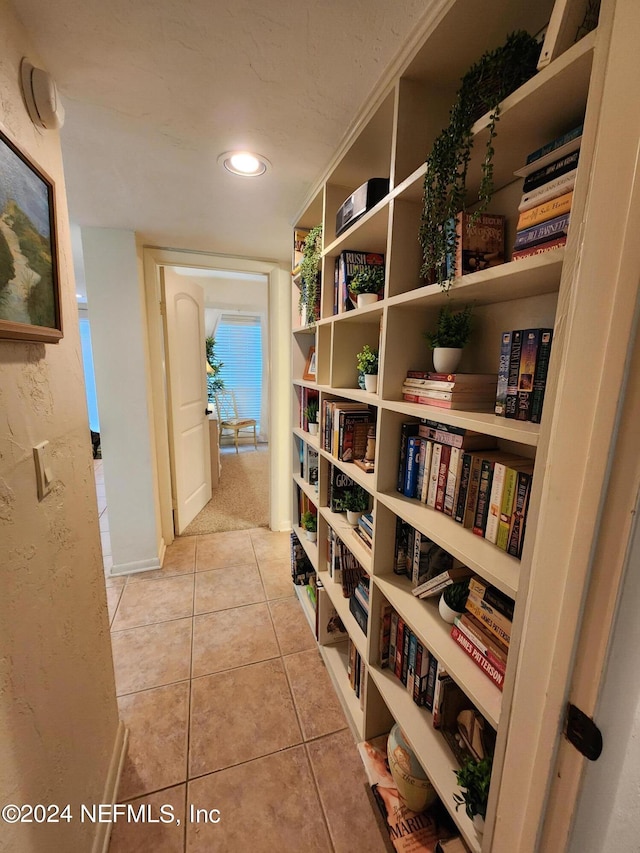 hallway with light tile patterned floors