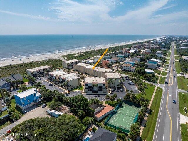 aerial view featuring a water view and a view of the beach