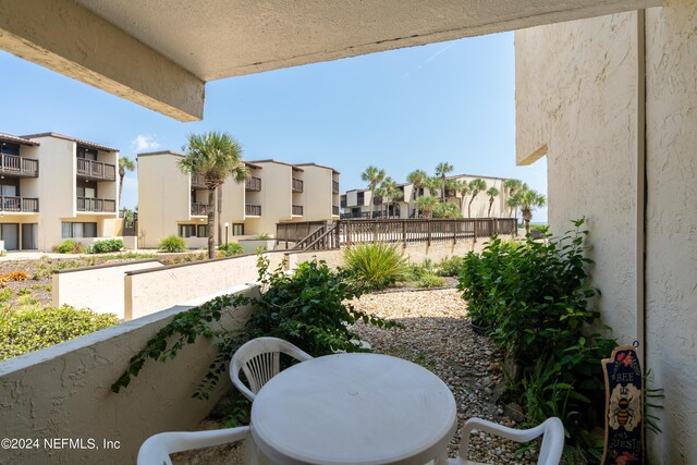 view of patio featuring a residential view and a balcony