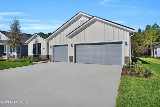 view of front of house with a garage and a front yard