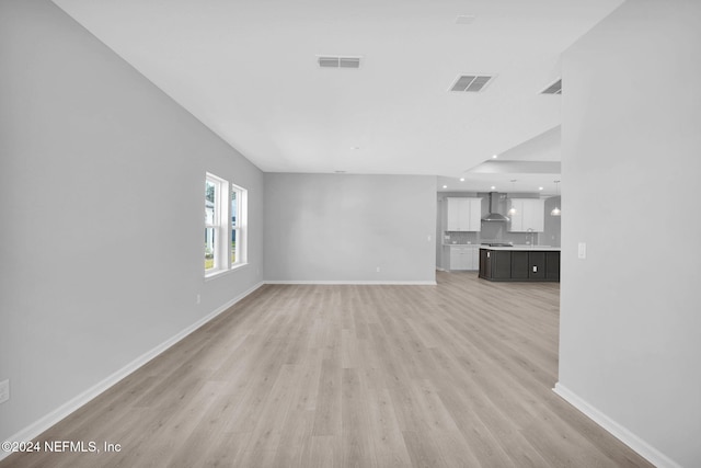 unfurnished living room featuring light wood-type flooring