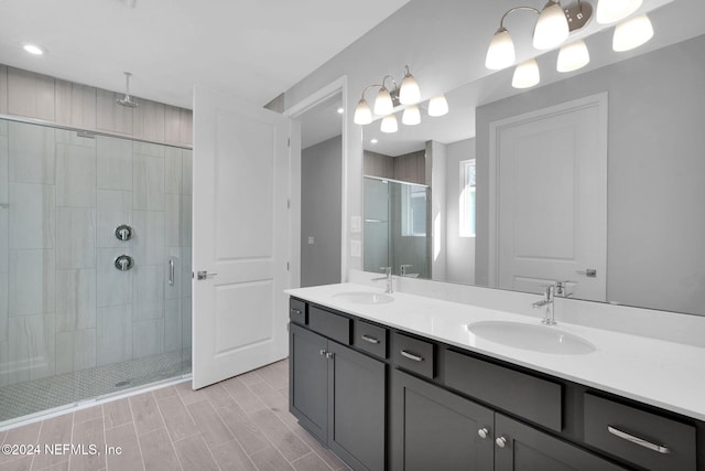 bathroom featuring vanity and an enclosed shower