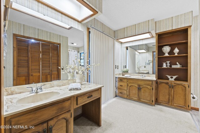 bathroom featuring vanity and a textured ceiling