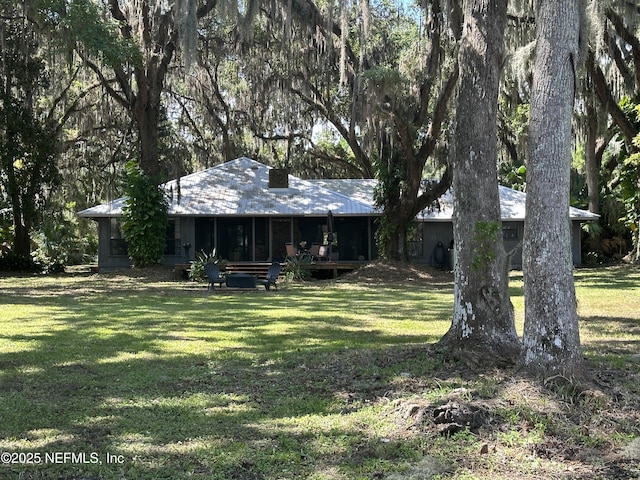 view of yard with a sunroom