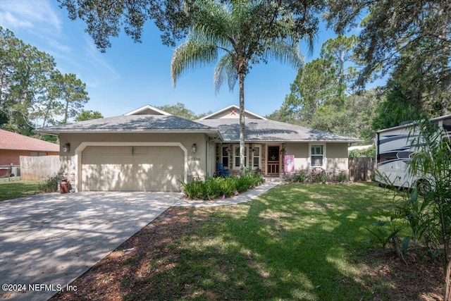 single story home with a garage and a front yard