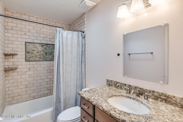 full bathroom with vanity, a textured ceiling, shower / bath combination with curtain, and toilet