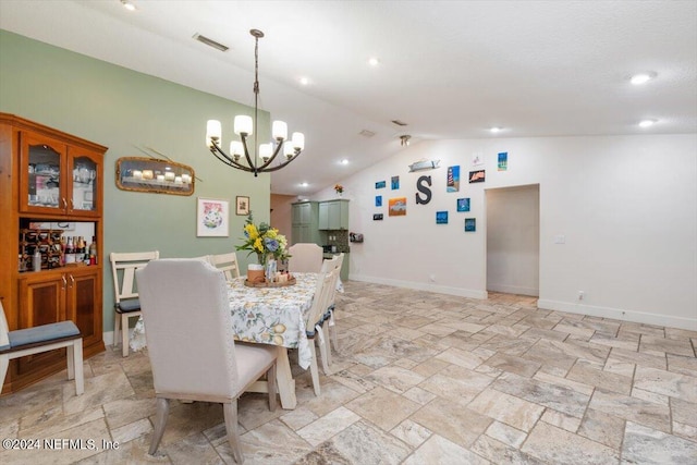 dining room featuring vaulted ceiling and an inviting chandelier