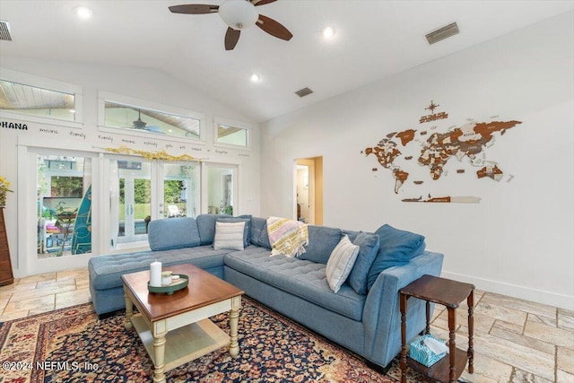 living room with french doors, ceiling fan, and high vaulted ceiling