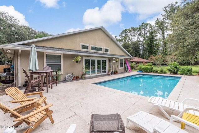 view of pool featuring a patio