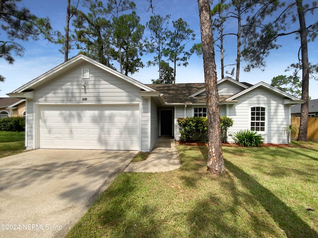 single story home with a garage and a front lawn