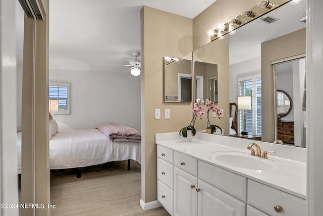 bathroom with ceiling fan and vanity