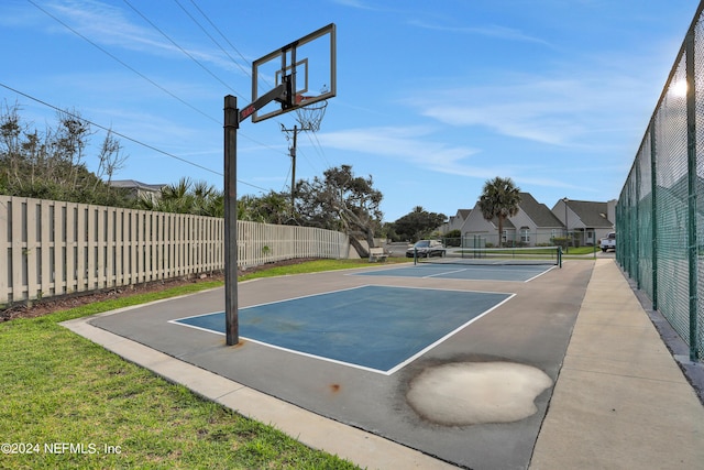 view of sport court featuring community basketball court and fence