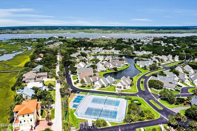 drone / aerial view with a residential view and a water view