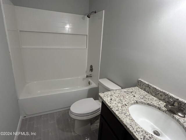 full bathroom with toilet,  shower combination, and vanity