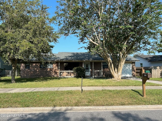 view of front facade with a garage and a front yard