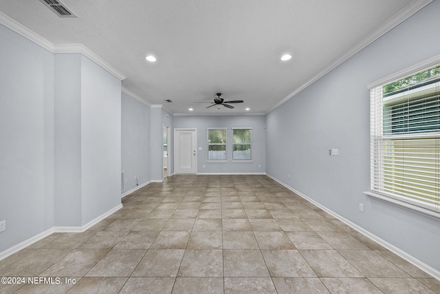 interior space with crown molding, a wealth of natural light, and ceiling fan