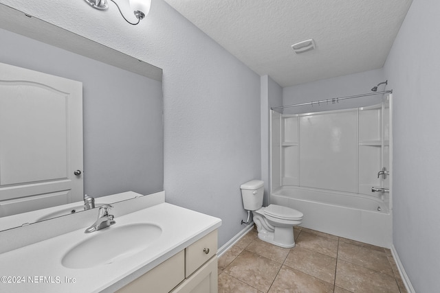 full bathroom with tile patterned floors, toilet, bathtub / shower combination, a textured ceiling, and vanity