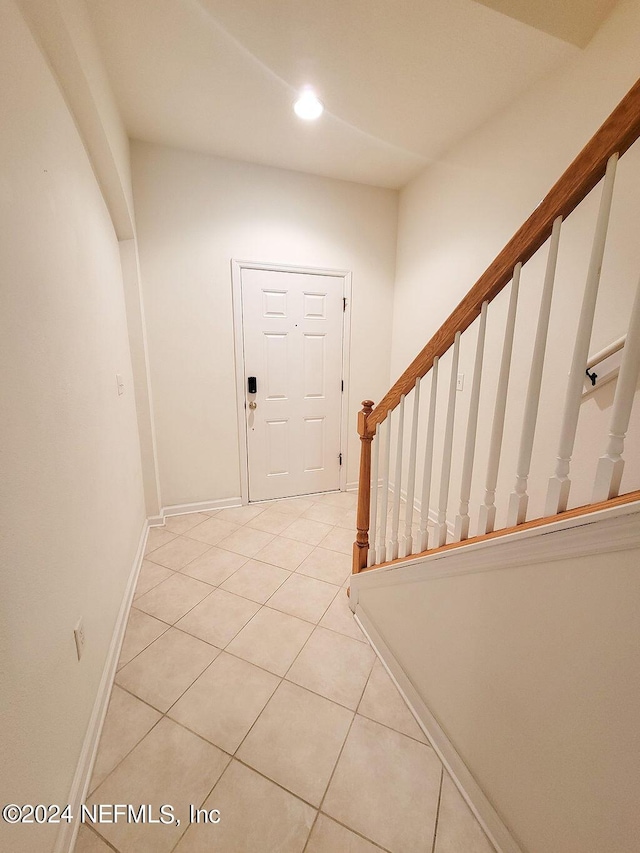 entryway featuring light tile patterned flooring