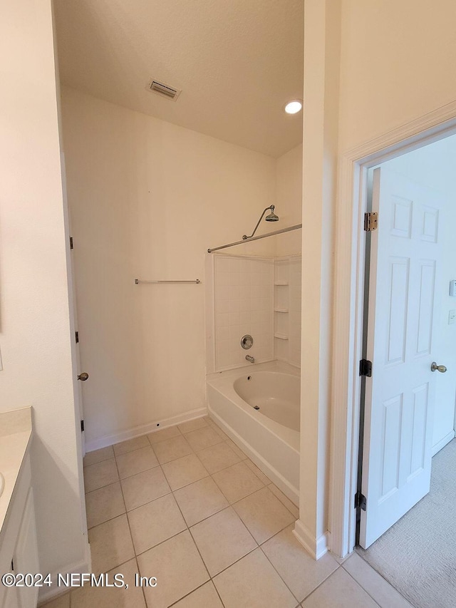 bathroom with tile patterned flooring, bathing tub / shower combination, and vanity