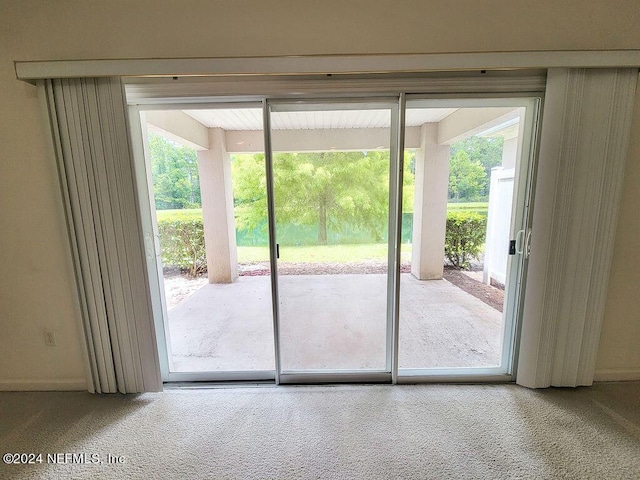 entryway with carpet floors