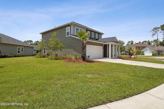 view of front of home featuring a garage and a front lawn