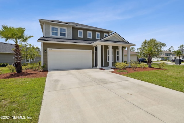 view of front of property featuring a porch, a garage, and a front lawn