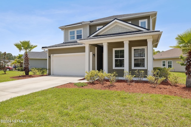 view of front of house with a garage, a porch, and a front lawn