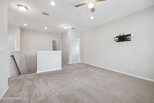 carpeted empty room with ceiling fan