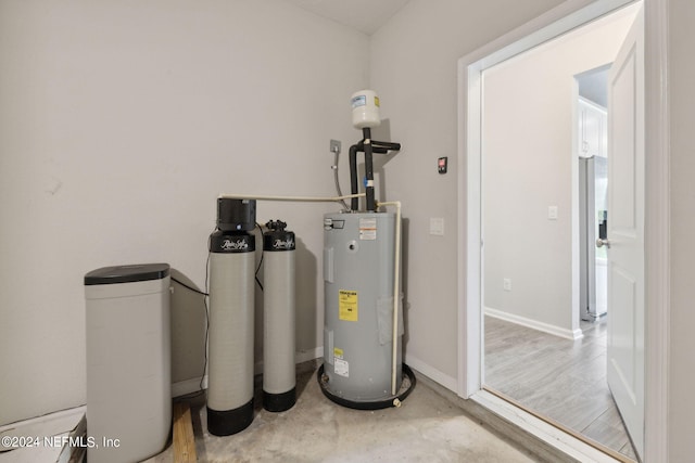 utility room featuring electric water heater