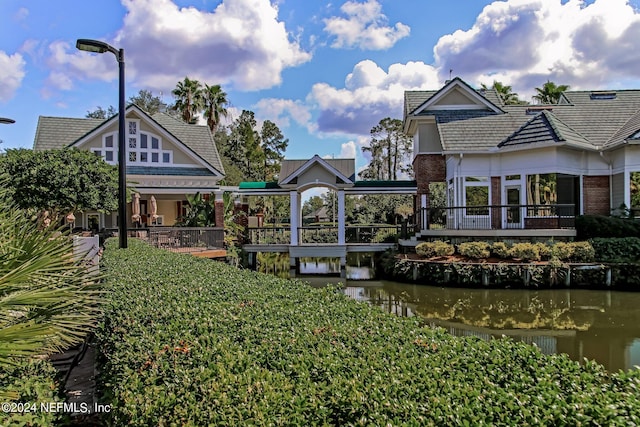 view of community with a water view