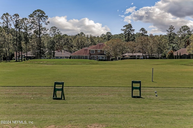 view of property's community with a yard