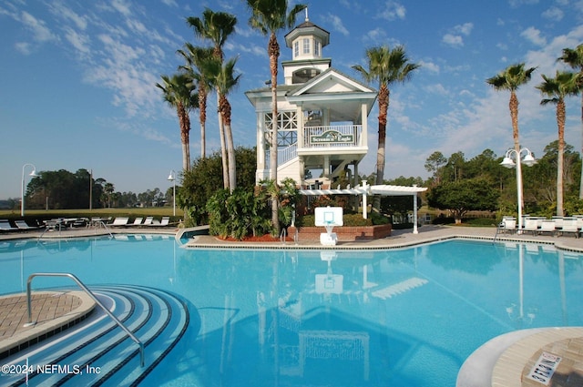 view of pool with a patio area and a pergola