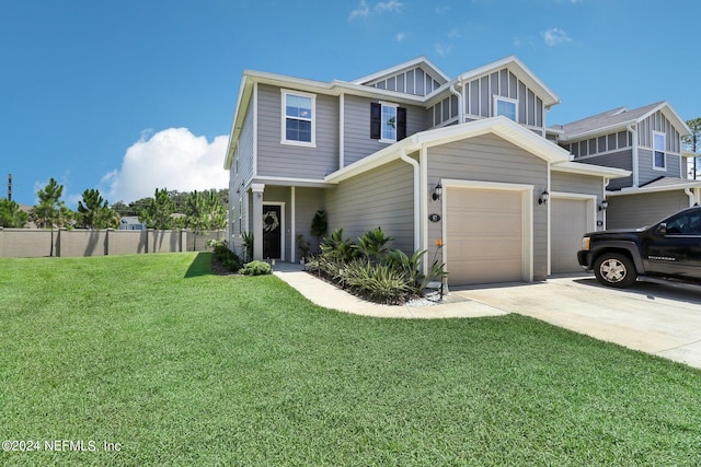 view of front of house featuring a garage and a front yard