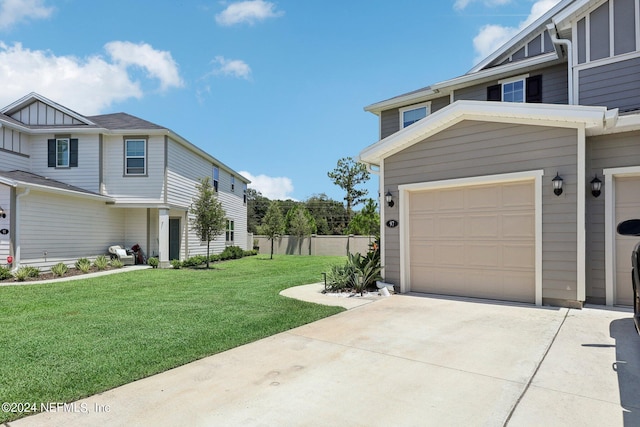 exterior space with a garage and a yard