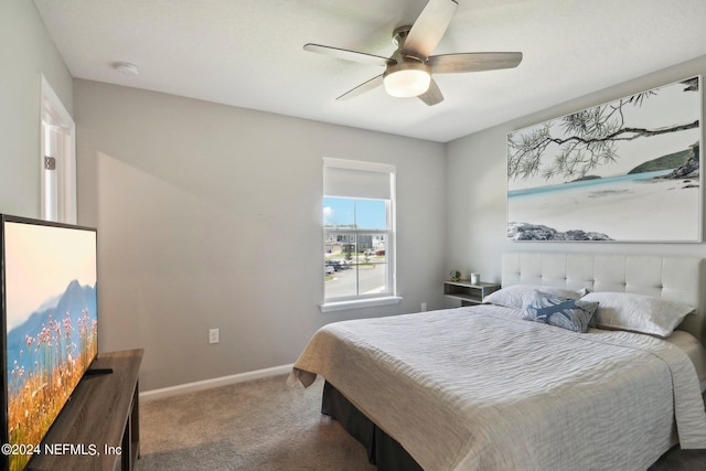 bedroom with ceiling fan and carpet flooring