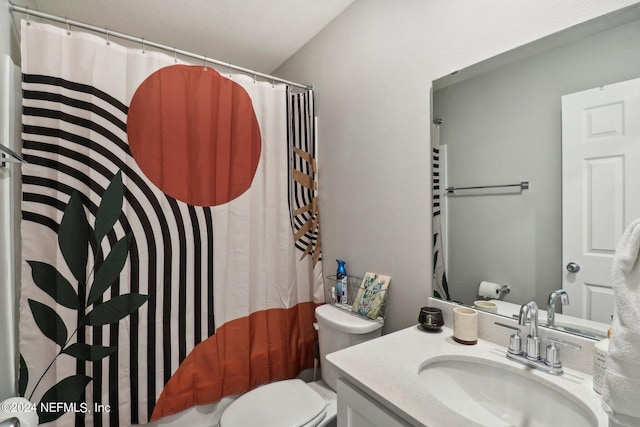 bathroom with vanity, a shower with shower curtain, and toilet