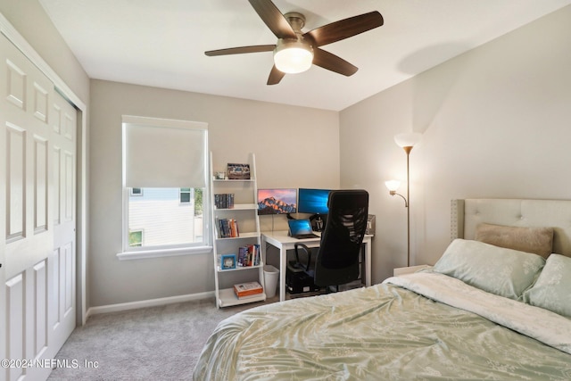 carpeted bedroom with a closet and ceiling fan