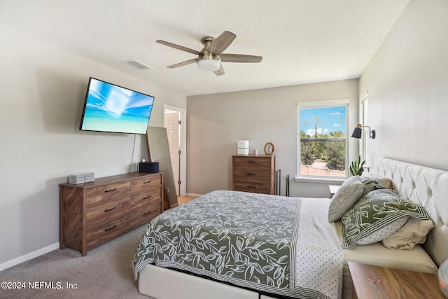 bedroom with ceiling fan and carpet