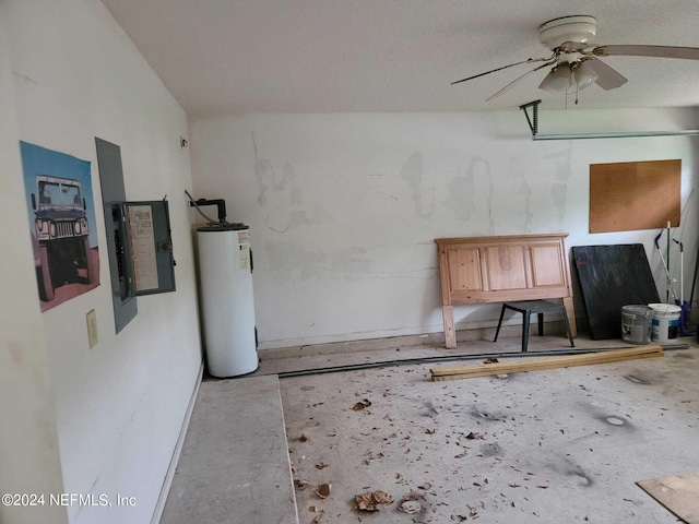 interior space with ceiling fan, lofted ceiling, electric water heater, and a textured ceiling