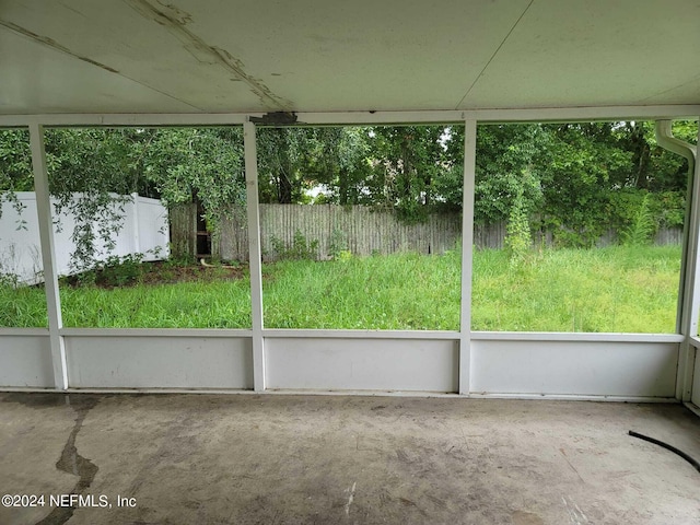 unfurnished sunroom featuring a healthy amount of sunlight