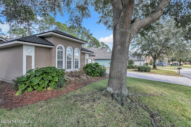 exterior space with a lawn